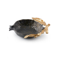 Decorative bowl with gold leaf accents on a white background
