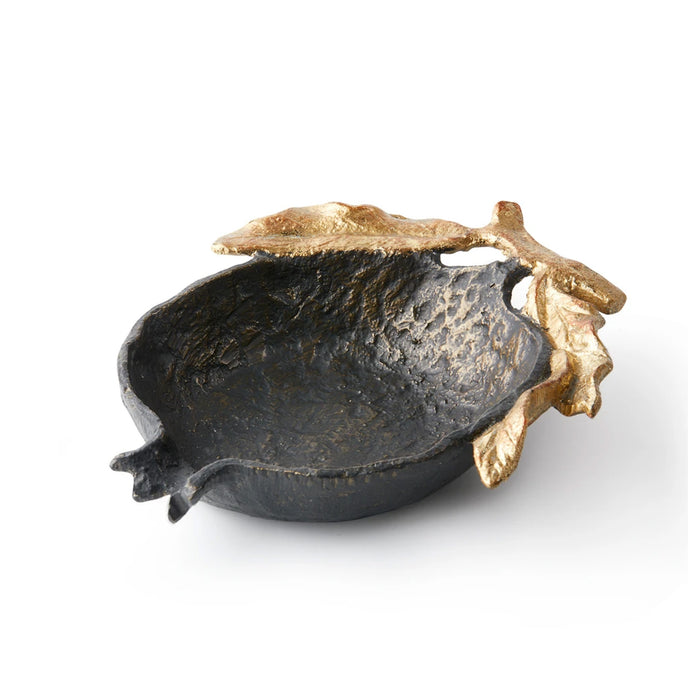 Decorative bowl with gold leaf accents on a white background