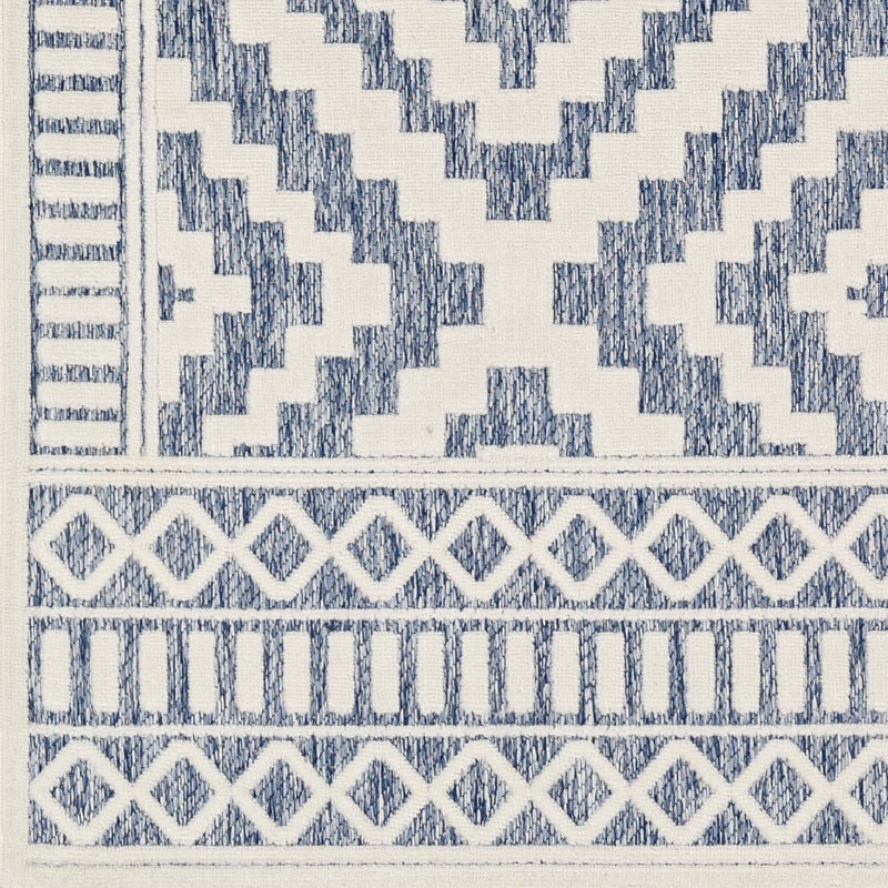 cream navy diamond patterned rug