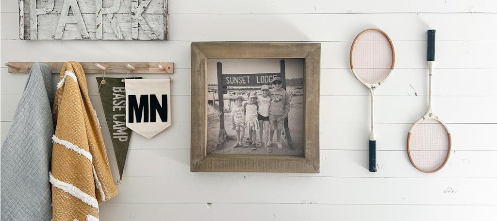 photo frame on a shiplap white wall with additional decor
