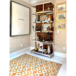 Vinyl Floorcloth in room with chrome bookcase and artwork