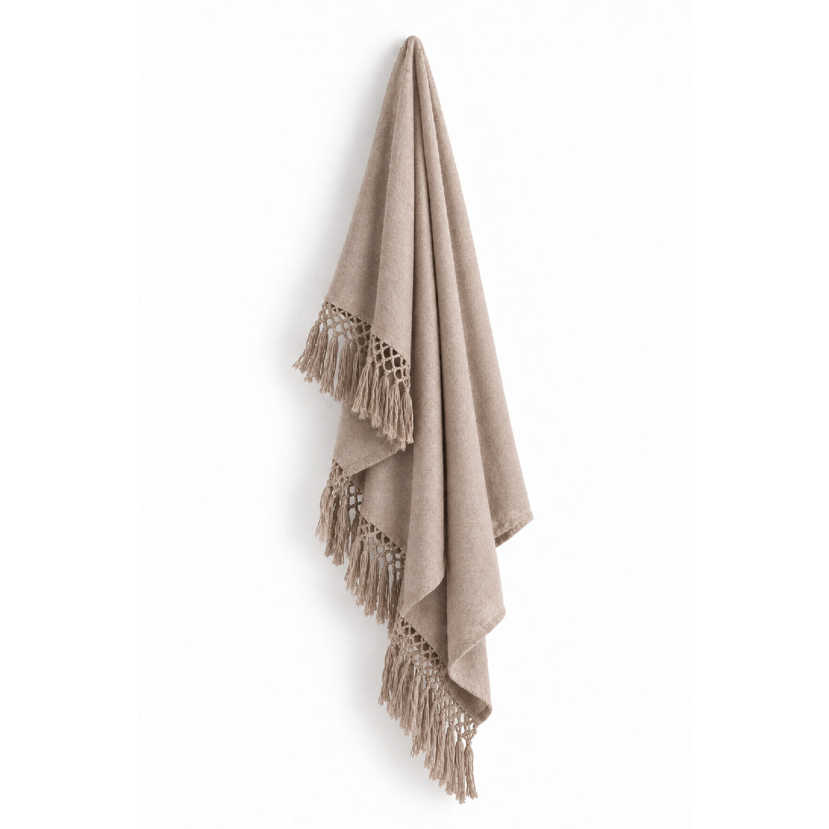 Auskin’s Alpaca Beige Cool Throw with fringes, made from luxury fiber, displayed against a white wall.