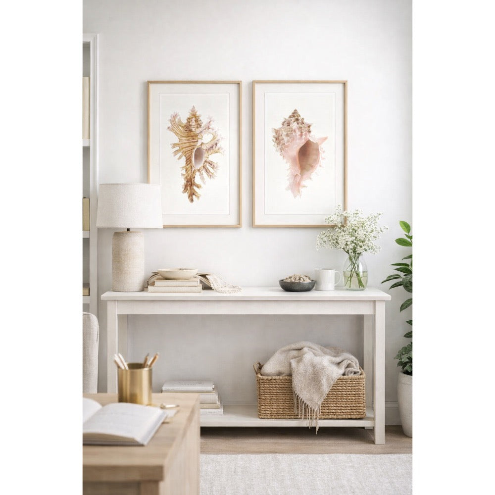 Nautical-themed room with shell art on the wall, a lamp, and decorative items.