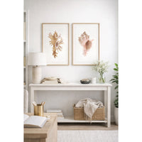 Nautical-themed room with shell art on the wall, a lamp, and decorative items.