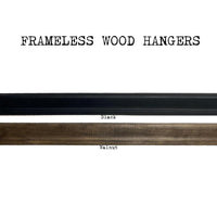 The Art Print Frameless Wood + Steel Hangers from Barloga Studios are displayed in two finishes: black and walnut. Ideal for displaying modern art prints, these elegant hangers seamlessly integrate into any decor while highlighting artwork with a sleek contemporary touch.