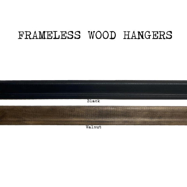 The Art Print Frameless Wood + Steel Hangers from Barloga Studios are displayed in two finishes: black and walnut. Ideal for displaying modern art prints, these elegant hangers seamlessly integrate into any decor while highlighting artwork with a sleek contemporary touch.