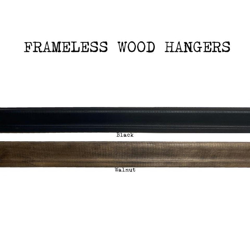 The Art Print Frameless Wood + Steel Hangers from Barloga Studios are displayed in two finishes: black and walnut. Ideal for displaying modern art prints, these elegant hangers seamlessly integrate into any decor while highlighting artwork with a sleek contemporary touch.