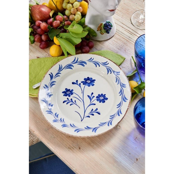 Abigails Casa Nuno Blue Flower Dinner Plates (set of 2) with fruits, green napkin, and blue glasses on table.