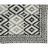 The Yellowstone Cabana Tablecloth by Abigails features a black and white tribal pattern with diamond shapes and an intricate border design, making it perfect for creating 100% cotton napkins.