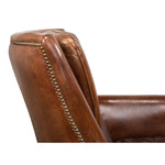 brown leather swivel armchair