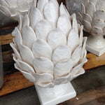 white ceramic pedestal artichoke