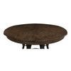 Large round dark wood table with gold studs 