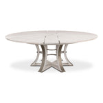 Large round white wood table with metallic studs