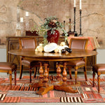 Sarreid, Ltd. round wood walnut stained dining table expandable adjustable four turned legs stored leaves