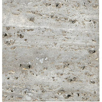 Close-up of the BSEID Travertine Marble Serving Tray, showcasing its textured gray surface with small holes and rough patterns, evoking a natural vibe.