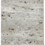 Close-up of the BSEID Travertine Marble Serving Tray, showcasing its textured gray surface with small holes and rough patterns, evoking a natural vibe.