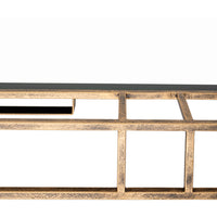 Close-up of Surya's Alpenglow Antique Gold Floor Mirror against a white background.