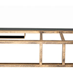 Close-up of Surya's Alpenglow Antique Gold Floor Mirror against a white background.