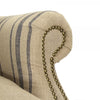 chair arms upholstered natural linen blue stripe lumbar pillow nailheads wingback wood feet