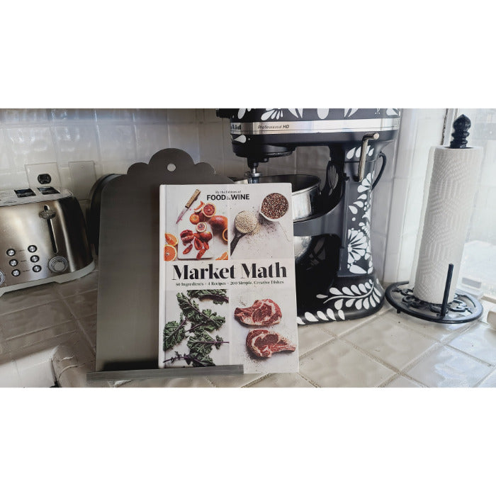 A BSEID Stainless Recipe Book / iPad Holder graces the kitchen, accompanied by a sleek mixer, a trusty toaster, and a paper towel holder in the background.