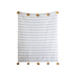 White and tan throw