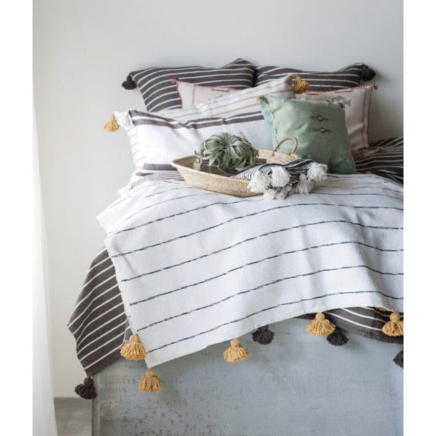 White and tan throw