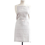 Natural oatmeal linen apron with pocket for casual entertaining.  Farmhouse style that is machine washable.