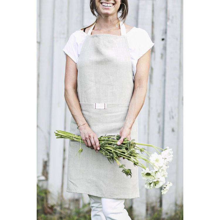 Natural oatmeal linen apron with pocket for casual entertaining.  Farmhouse style that is machine washable.