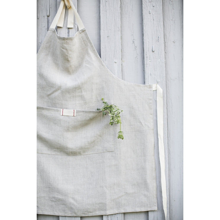 Natural oatmeal linen apron with pocket for casual entertaining.  Farmhouse style that is machine washable.