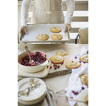 Natural oatmeal linen apron with pocket for casual entertaining.  Farmhouse style that is machine washable.