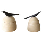 beige clay canister black bird handle 2