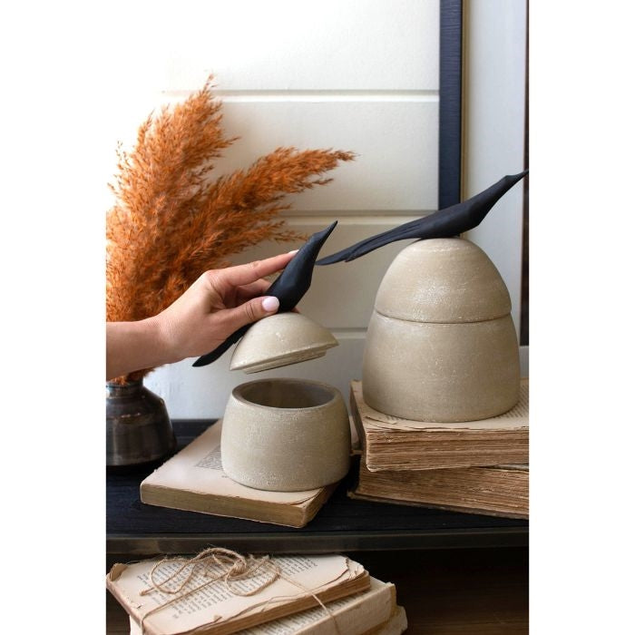 beige clay canister black bird handle 2