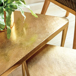 Gold triangular side tables