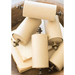 The Kalalou Table Top Wooden Note Roll Dispenser features five vintage-style 4" paper rolls with metal handles, neatly arranged on a wooden tray. Underneath, you'll find additional note rolls and extra paper sheets for your convenience.
