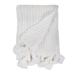 white knitted throw tassels