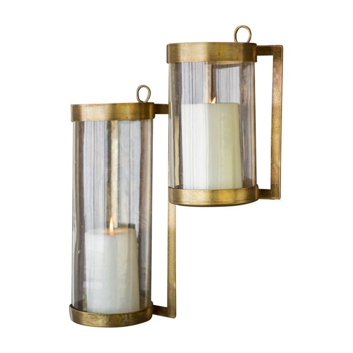 Two Glass + Antique Brass Candle Wall Sconces by Kalalou, wall-mounted with lit candles.