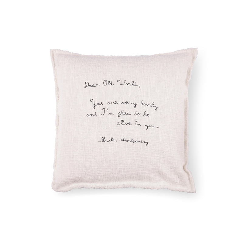 cream square pillow l.m. montgomery quote