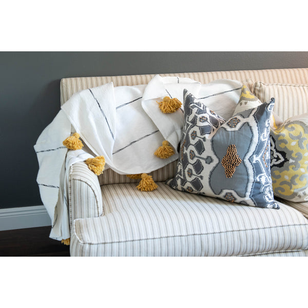 White and tan throw