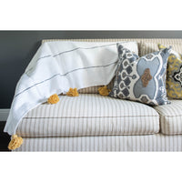 White and tan throw