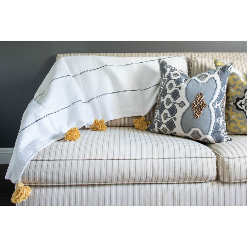 White and tan throw