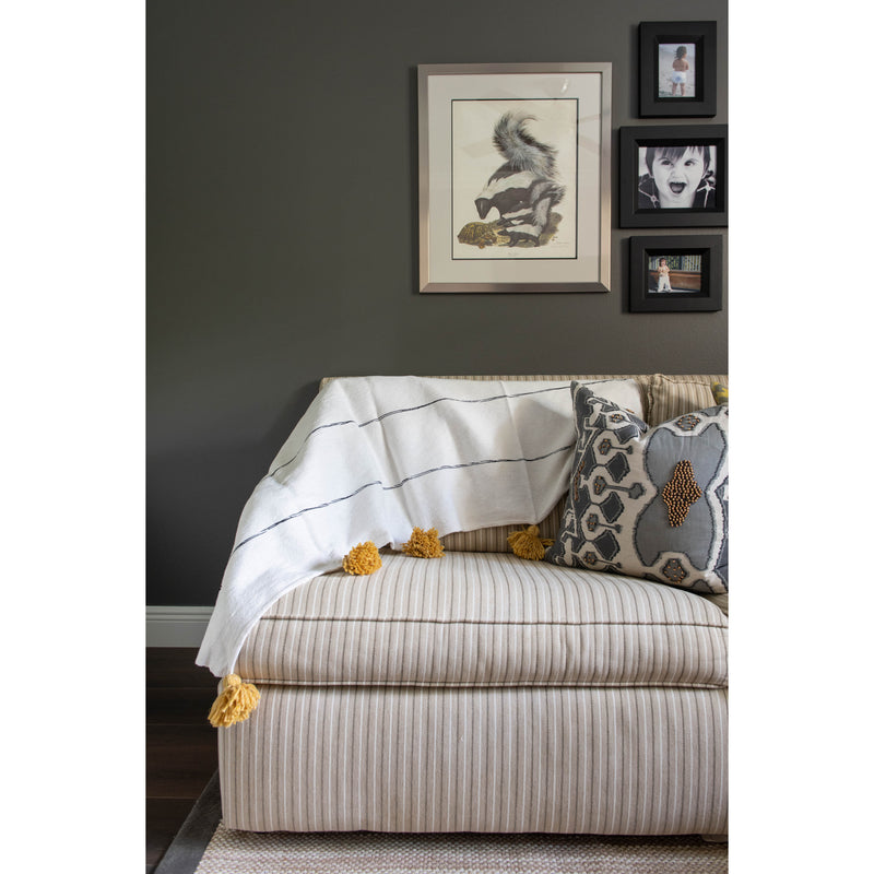 White and tan throw