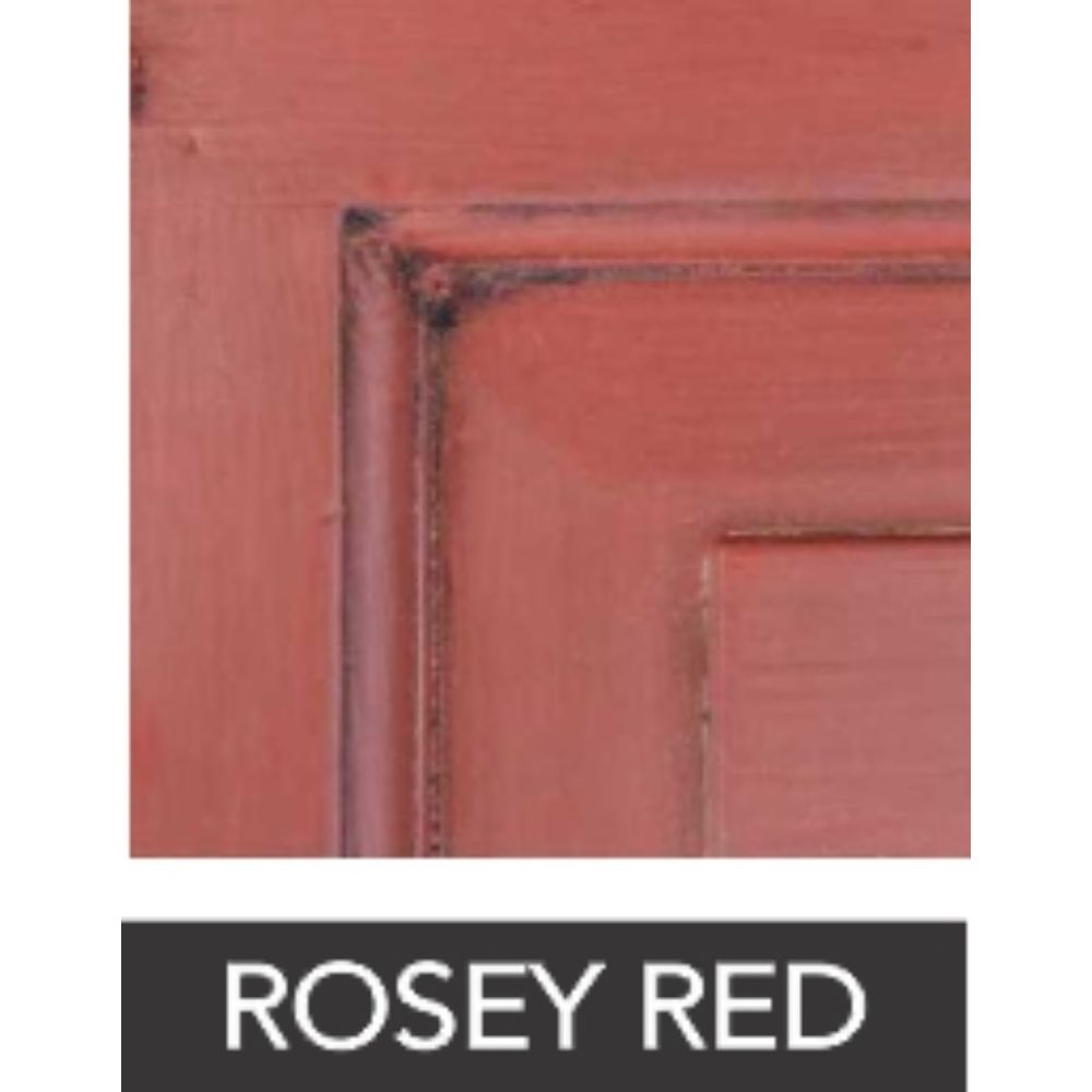 Close-up of a red-orange painted wood panel with worn edges.