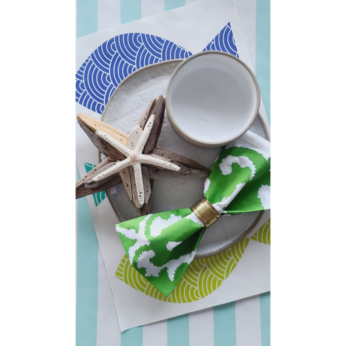 Sindoor Green Screened Napkins (set of 4) by Allem Studio, along with a decorative bowl, star-shaped ornament, and green patterned bow tie.