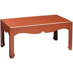 red coffee table curved detail gold accents