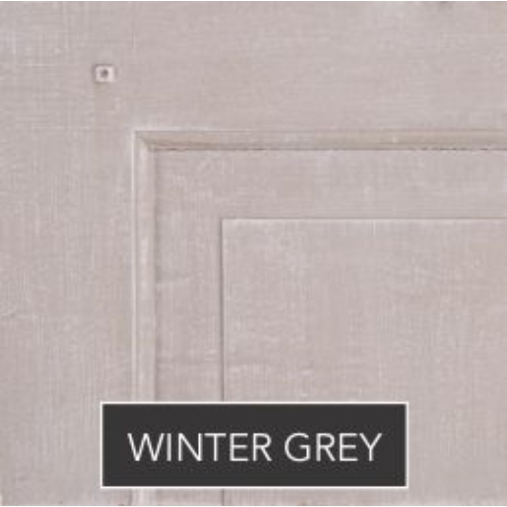 Close-up of a heavy wood headboard with winter grey finish and label.